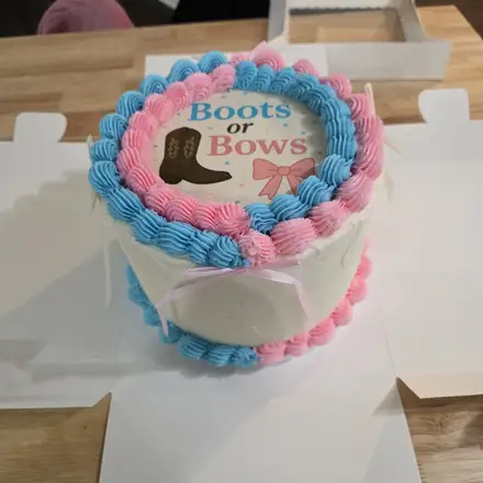 Boots or Bows gender reveal cake
