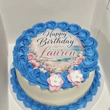 Blue birthday cake with sugar flowers