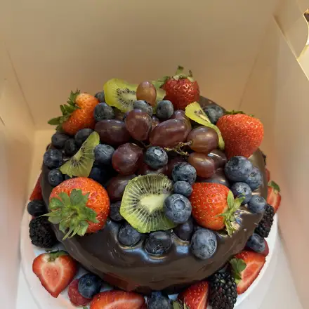 Chocolate cake topped with fresh fruit