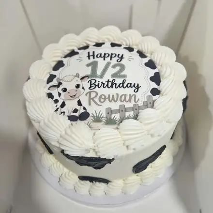 Cow-print half birthday cake