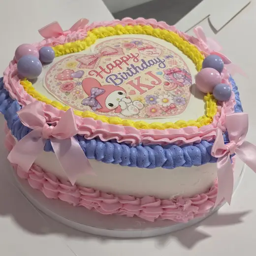 A pink custom heart cake