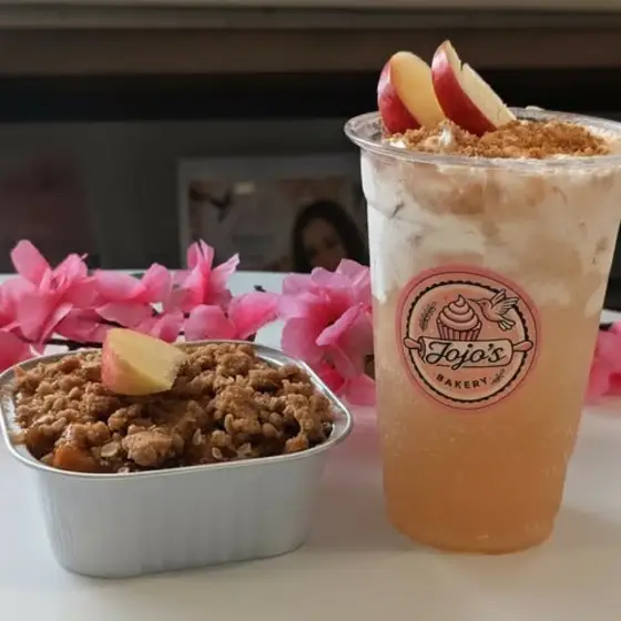 An iced drink and apple crisp in a JoJo's cup
