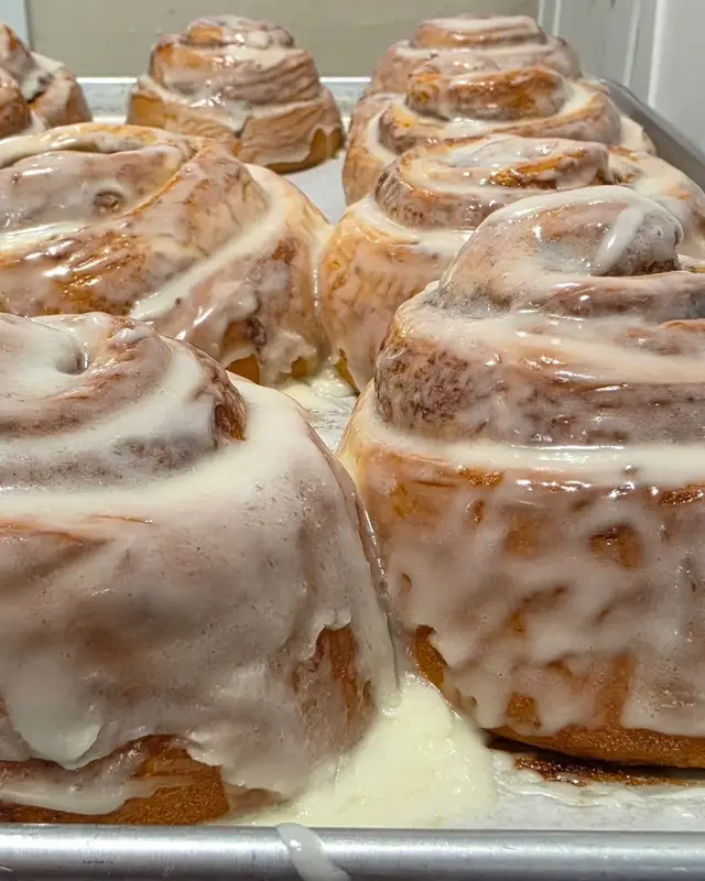A tray of iced cinnamon rolls